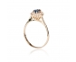 Gold vintage ring with sapphire trimmed in diamonds vertical view